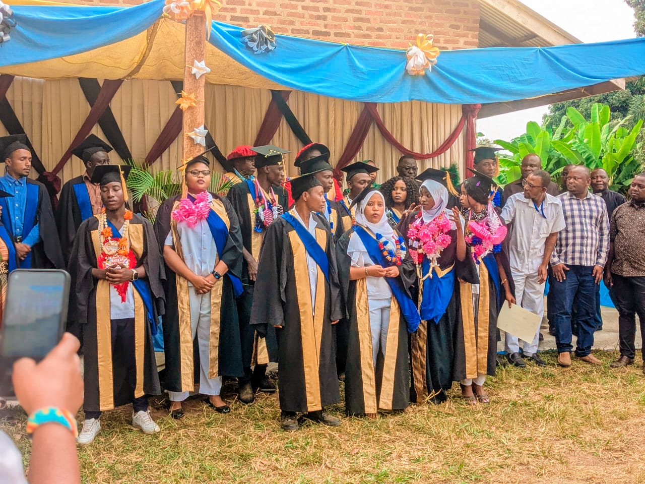 Group photo of graduates with their teachers